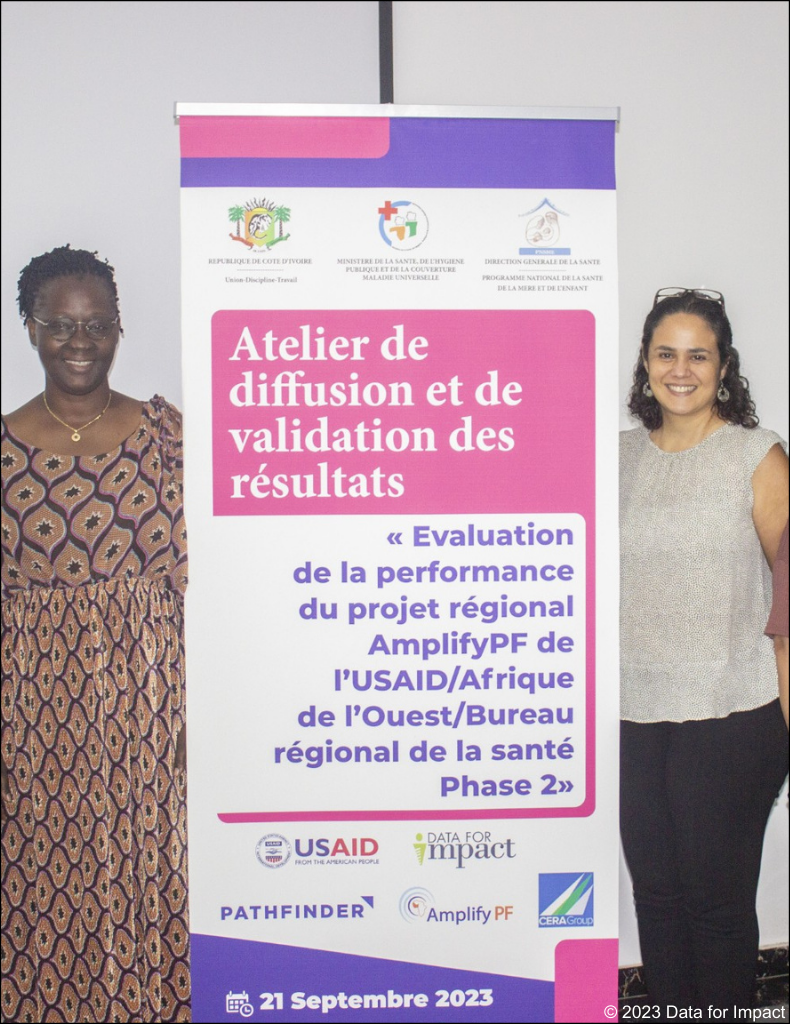 Photo showing two members of the team at a dissemination event in Cote d’Ivoire with Data for Impact (D4I) and CERA Group.
