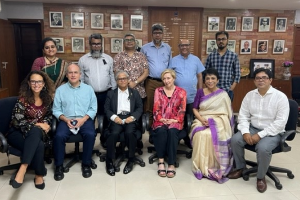 Group photo at University of Dhaka event. 